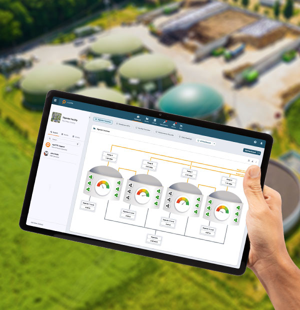 A hand-held tablet displaying stats over digital water tanks.